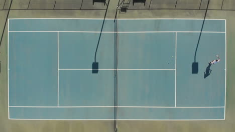 diverse male tennis players holding rackets and playing tennis at court