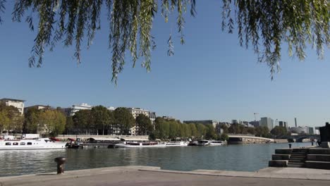 timelapse from paris, france over the boats on seine