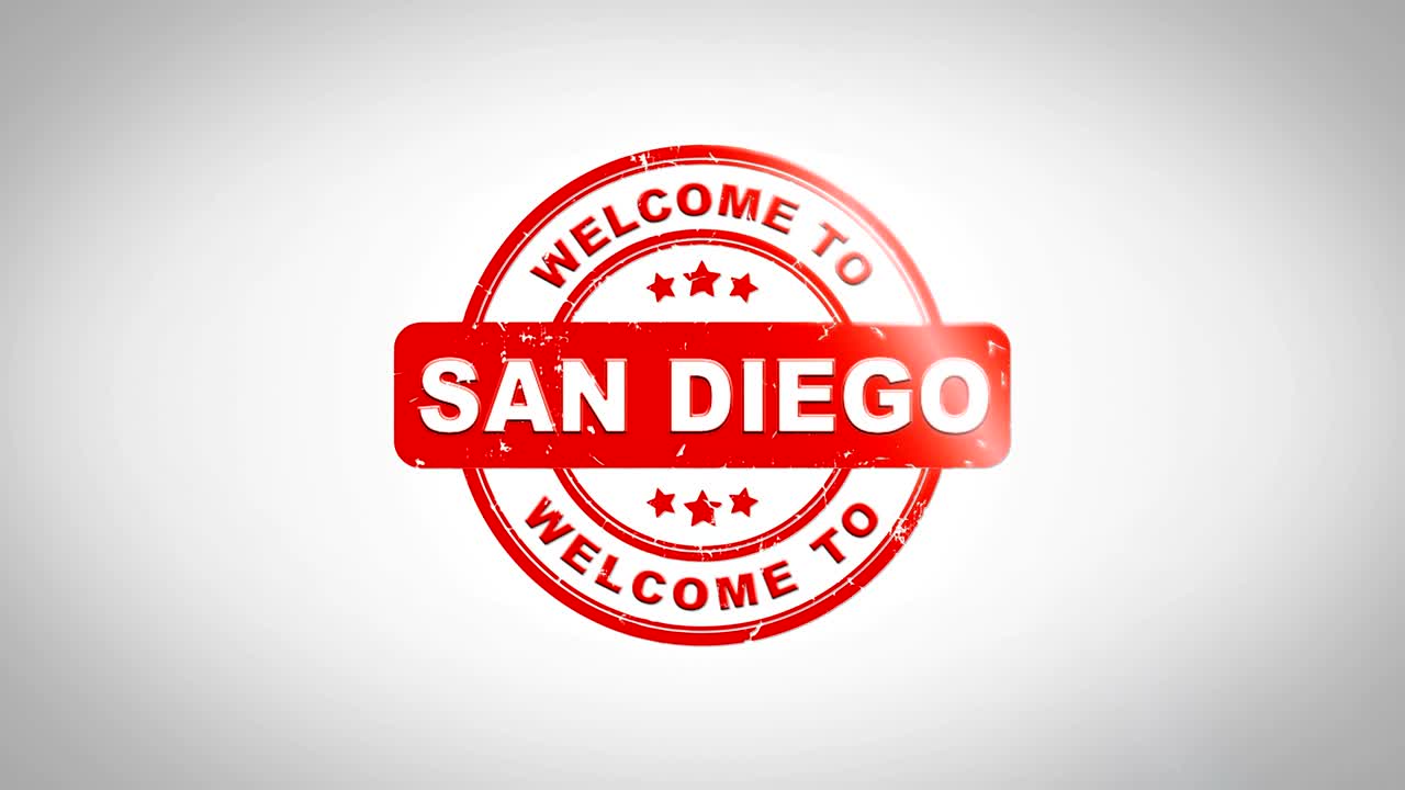 bienvenido a san diego firmado texto de estampado animación de sello de madera. tinta roja en papel blanco limpio fondo de superficie con fondo mate verde incluido.