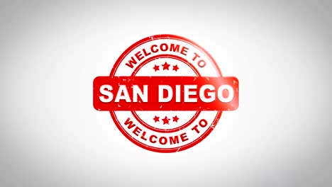 welcome to san diego signed stamping text wooden stamp animation. red ink on clean white paper surface background with green matte background included.