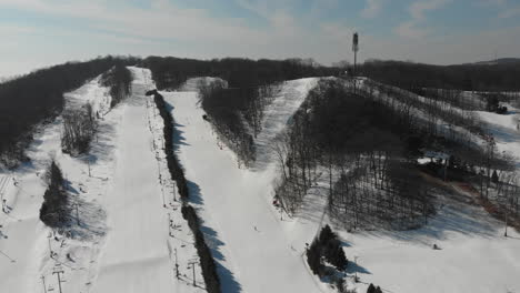 Drone-view-of-ski-resort-during-snowy-winter