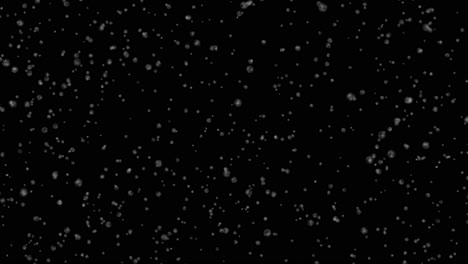 nieve cayendo sobre un fondo negro