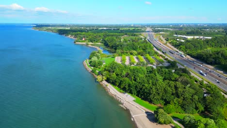 aerial over lake ontario and charles daley park next to qew highway, ontario