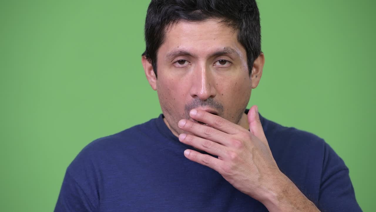 Hispanic man looking shocked