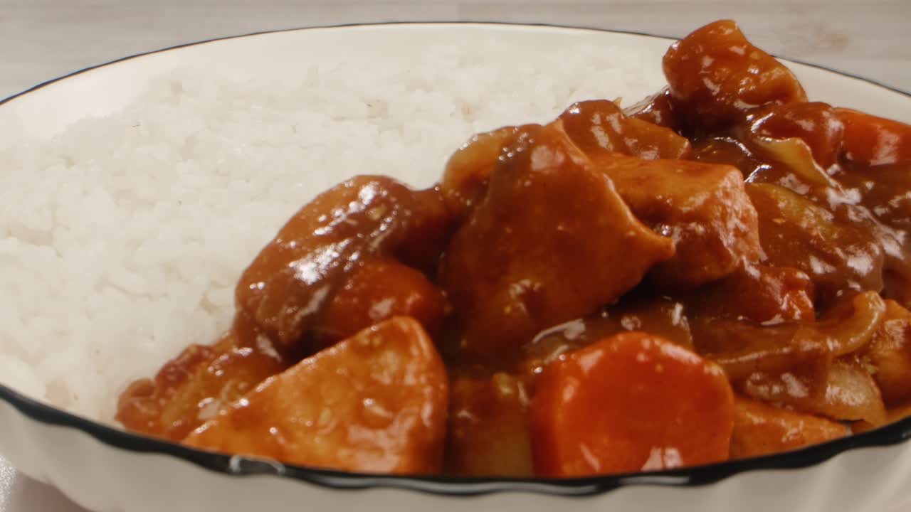 Japanese curry rice with fry pork Tonkatsu, Katsu Kare, Japanese breaded cooking dinner in restaurant, close up macro of asian food