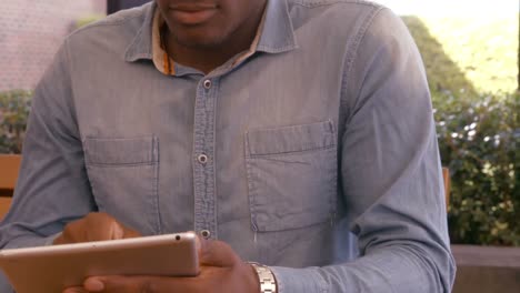 Handsome man using tablet