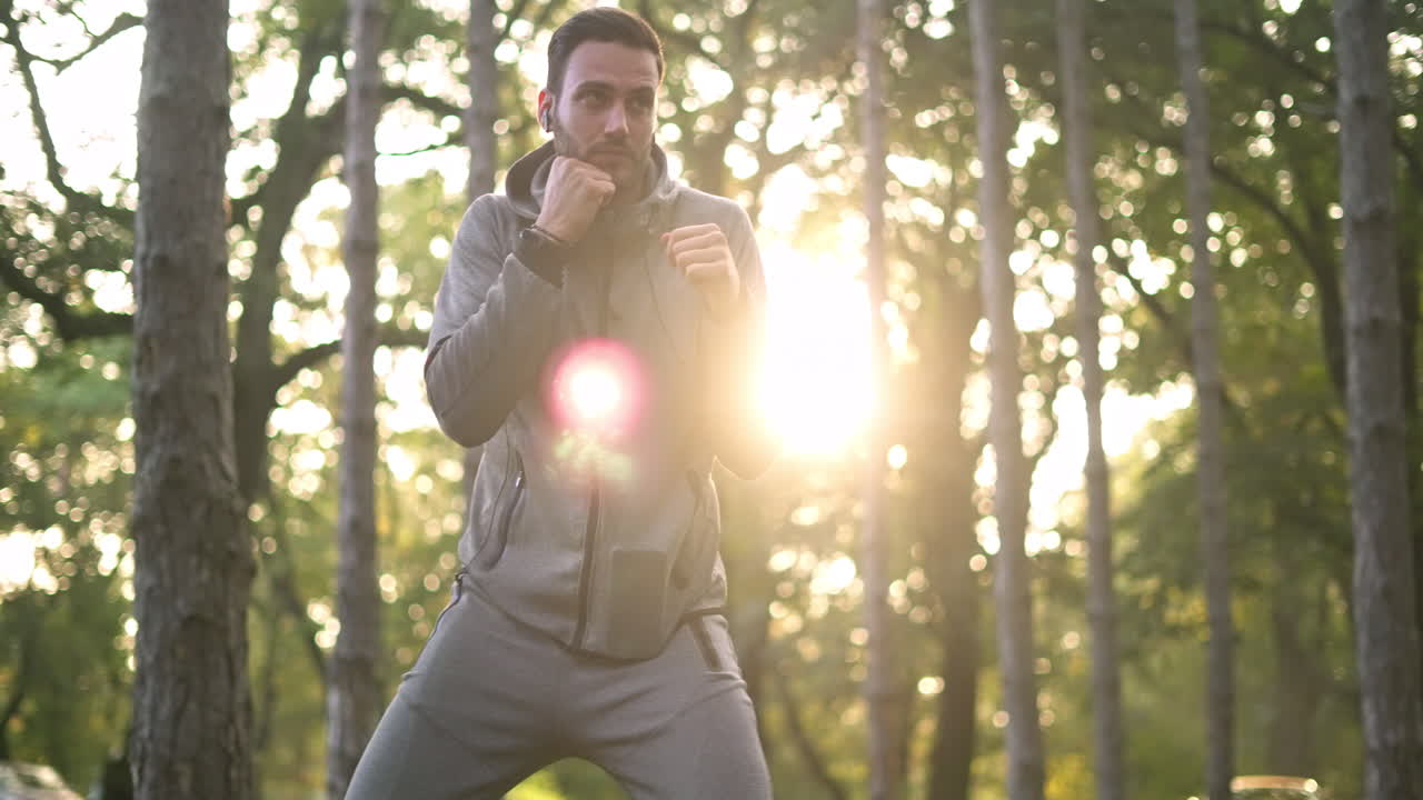 Man doing boxing workout in nature