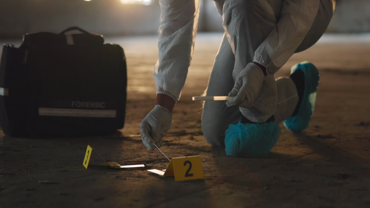 Forensic Investigator at Crime Scene Collecting Evidence