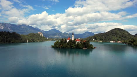 Lake-Bled-in-the-town-of-Bled-is-a-popular-tourist-destination,-and-mostly-known-for-the-small-island-in-it-with-the-pilgrimage-church-among-other-buildings