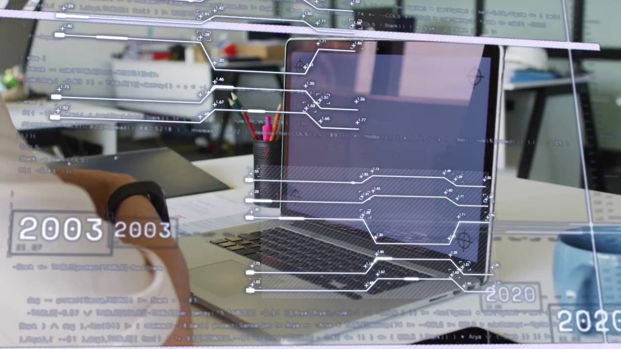 Woman raising wrist while circuit timeline overlay appearing over laptop, visualizing tech timeline