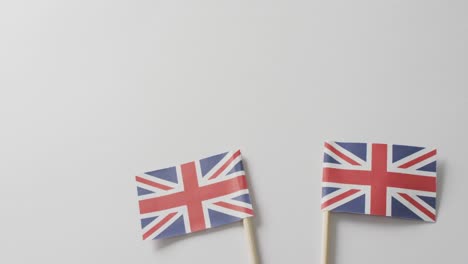 video of flags of great britain lying on white background