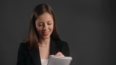 woman writing in a notebook