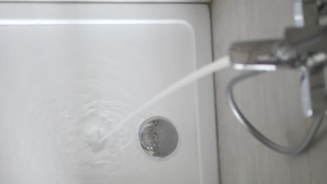 water running in a bathroom sink