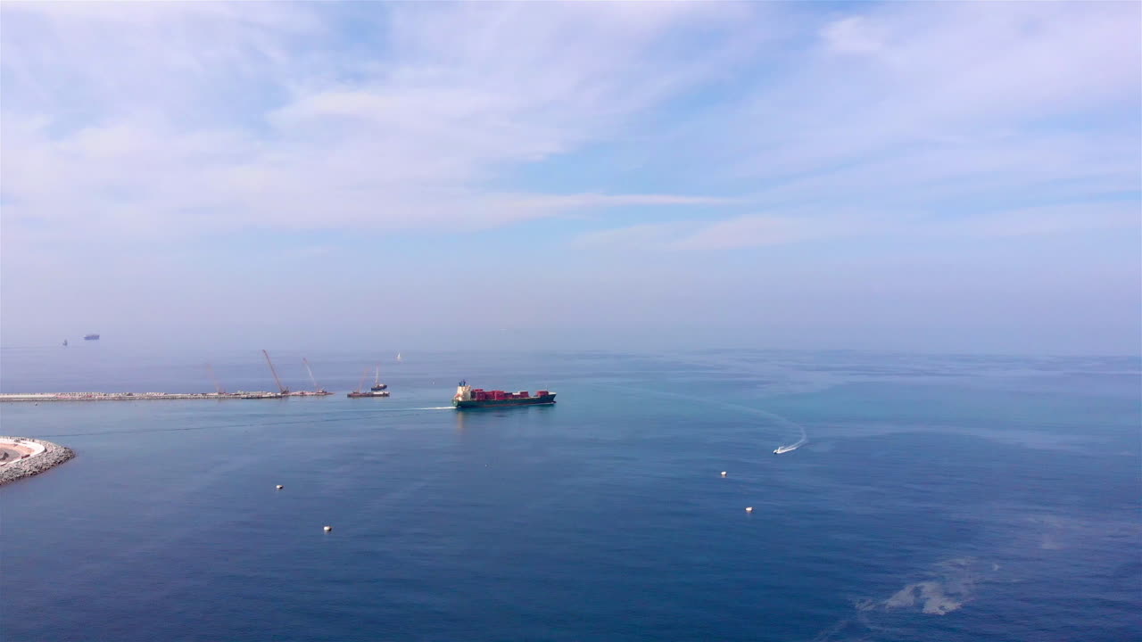 Drone footage of Cargo Ship Leaving harbor
