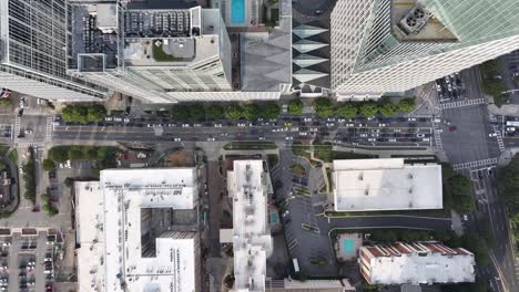 high angle view of urban city skyscrapers and busy street, air conditioner exhaust vents at skyline building rooftop, atlanta, georgia, usa