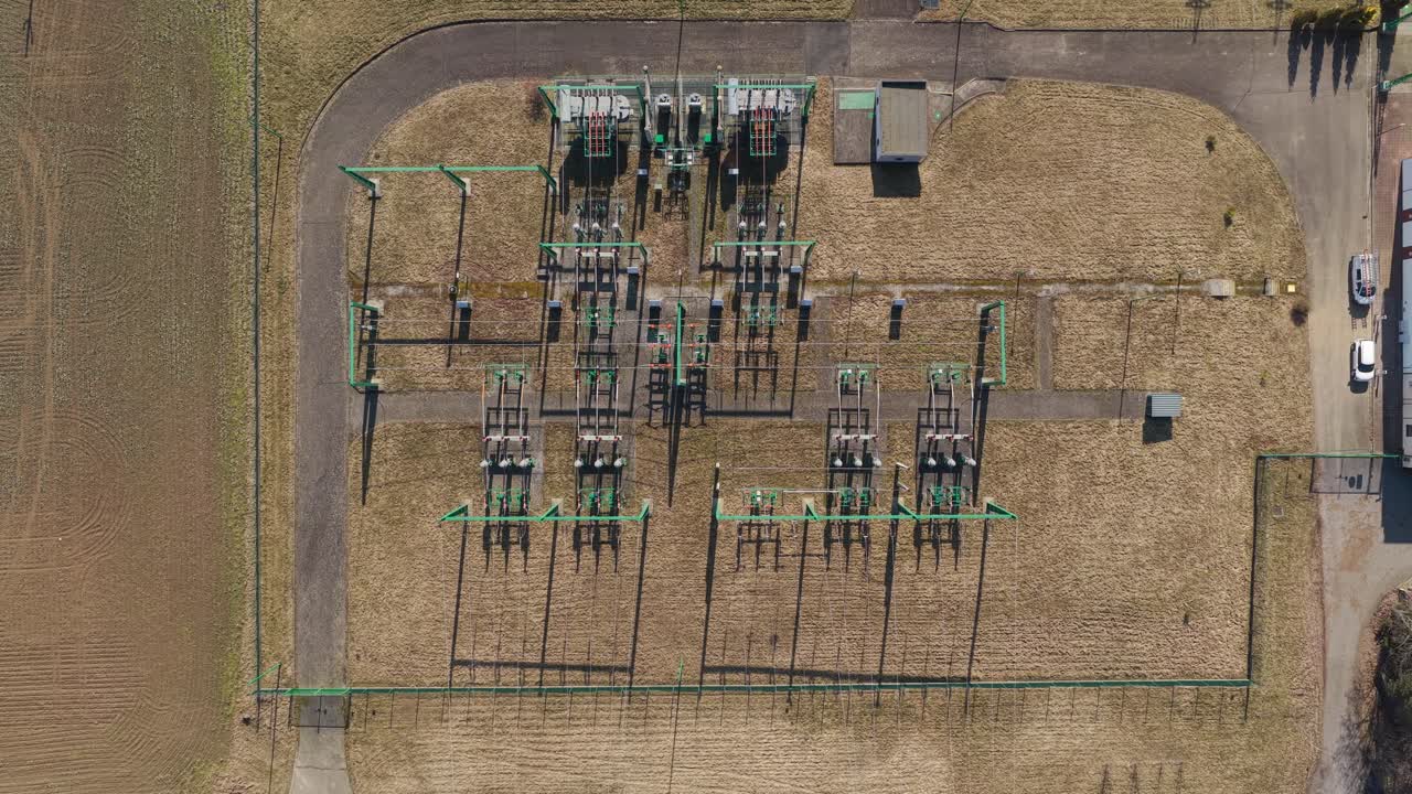 Drone shot of power substation with transformers and steel frames. Electrical grid network in Svitavy industrial landscape
