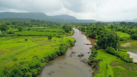 canal in the middle of the crop fields bird eye view