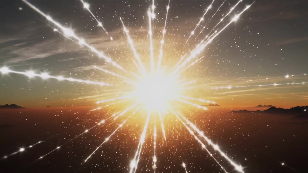 Nouseva aurinko säteilee säteittäisiä juovia ja kimallusta sumuisen vuoristohorisontin yllä, aiheuttaen sokaisevan välähdyksen.