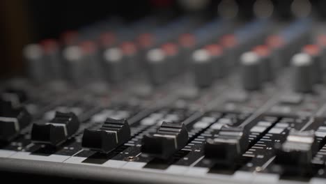 close-up of the buttons of a modern mixing console