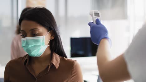 video of employees going through mandatory temperature checks in office