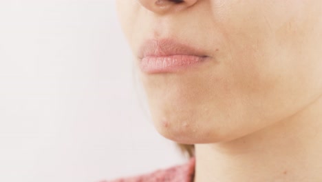 woman eating chocolate dragee in close-up. chocolate.