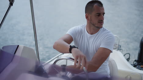 man driving a boat on the water