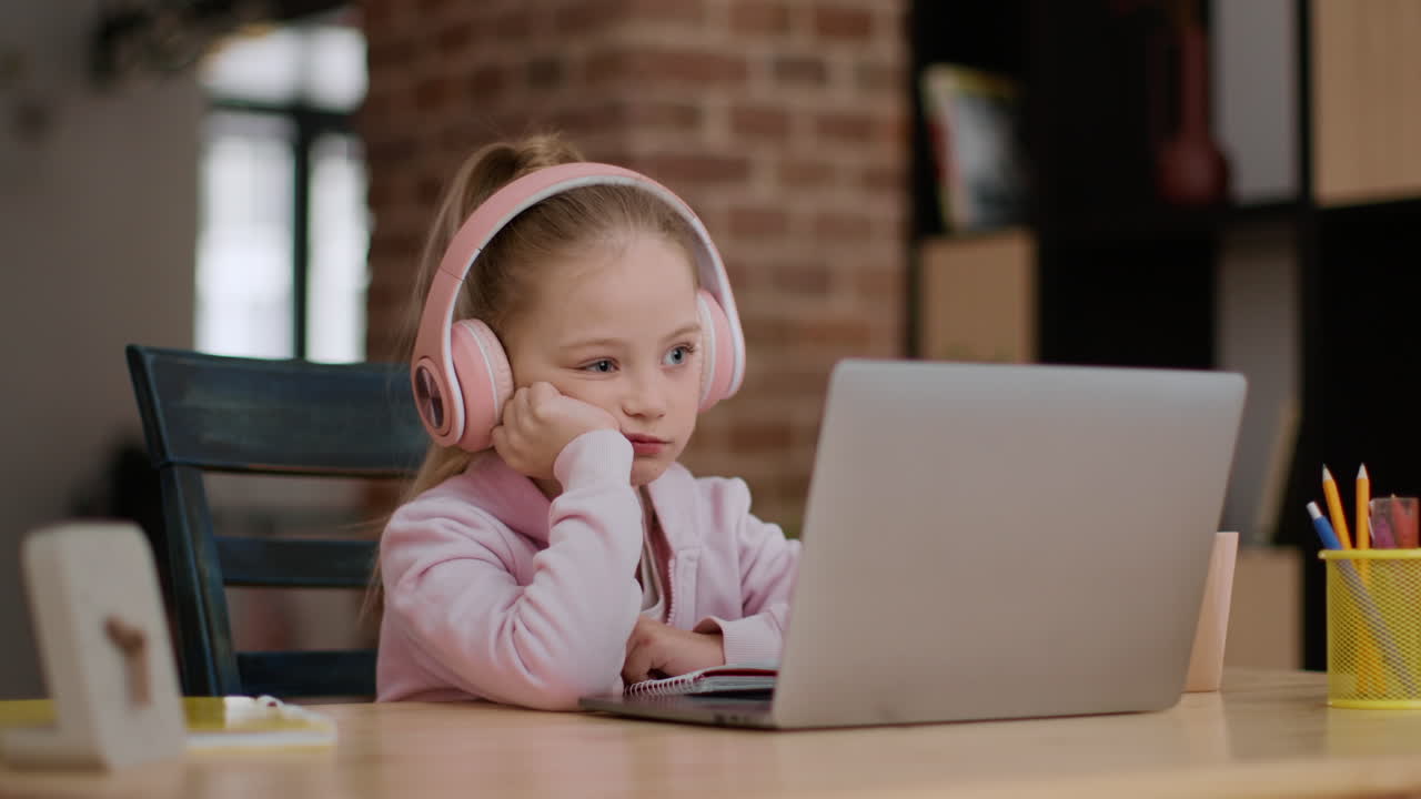 Young girl engaged in online class/study session