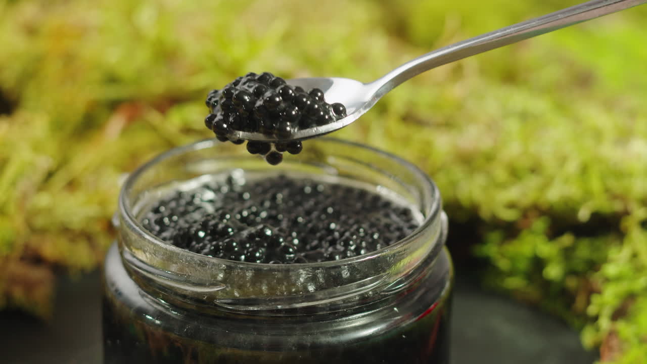 Black Caviar in a Glass Jar with Spoon