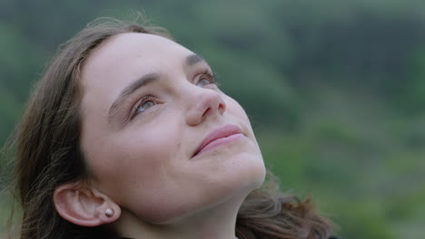 close up portrait of happy woman looking up smiling enjoying freedom outdoors exploring wanderlust contemplating spiritual journey in countryside breathing fresh air feeling positive