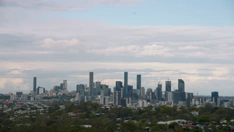 4k view of scenic brisbane cbd cityscape buildings with slow moving clouds in sky, australia