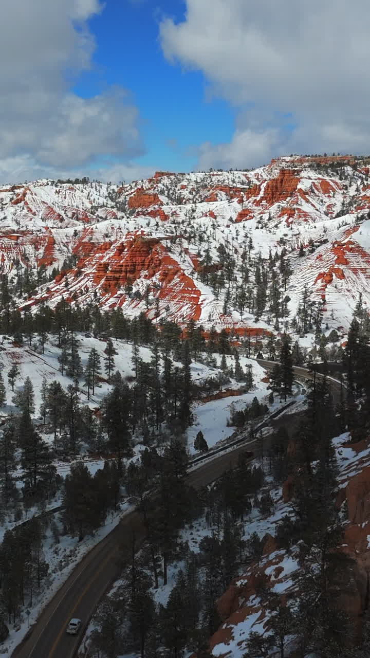 Vertical View Of Snow-Covered Red Rock Mountains In Utah, United States. Aerial Drone Shot