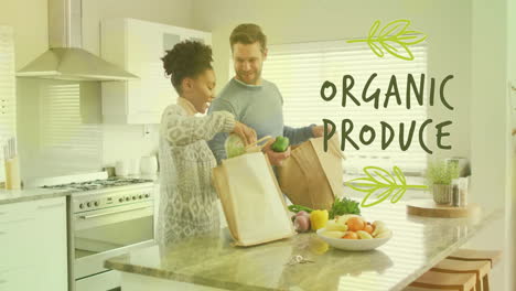 animation of organic produce text over diverse couple preparing healthy meal in kitchen