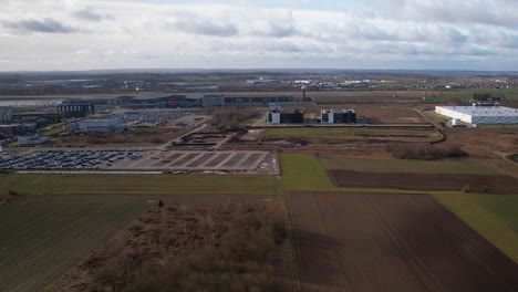 aerial view of airport gdansk in poland surrounded by rural area during cloudy day,poland