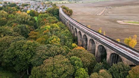 drone footage of the penistone railway station and stone built viaduct near barnsley, south yorkshire