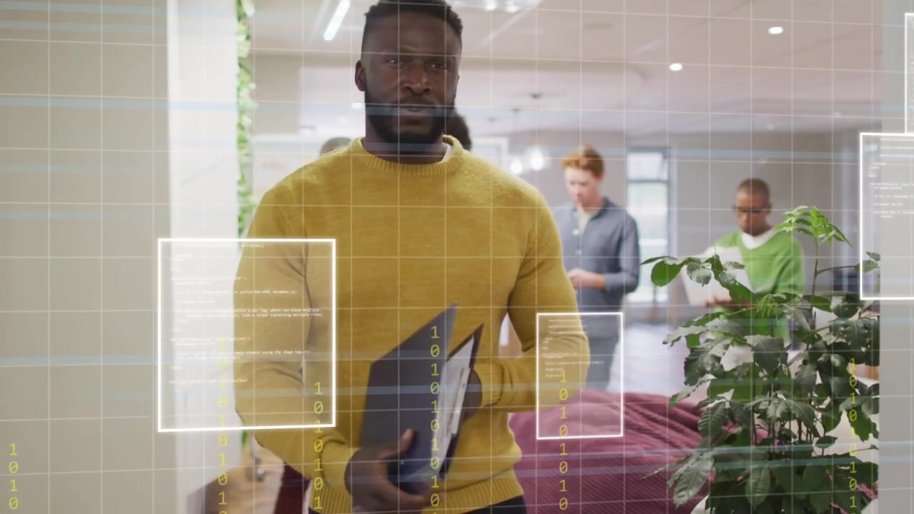 Lead man flipping folder pages and tapping, walking and leading team, showing business data overlay