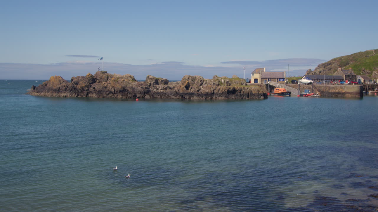 wide shot looking across portpatrick harbour to the Marina and lifeboat station