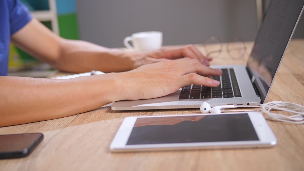 Person Working on Laptop and Tablet