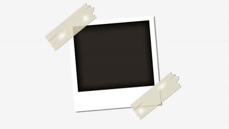 foto instantánea en blanco con cinta adhesiva