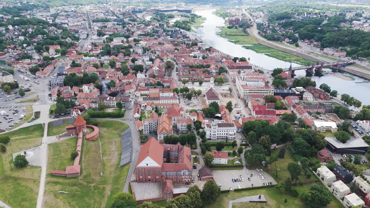 Red rooftops of Kaunas city old town, aerial orbit view
