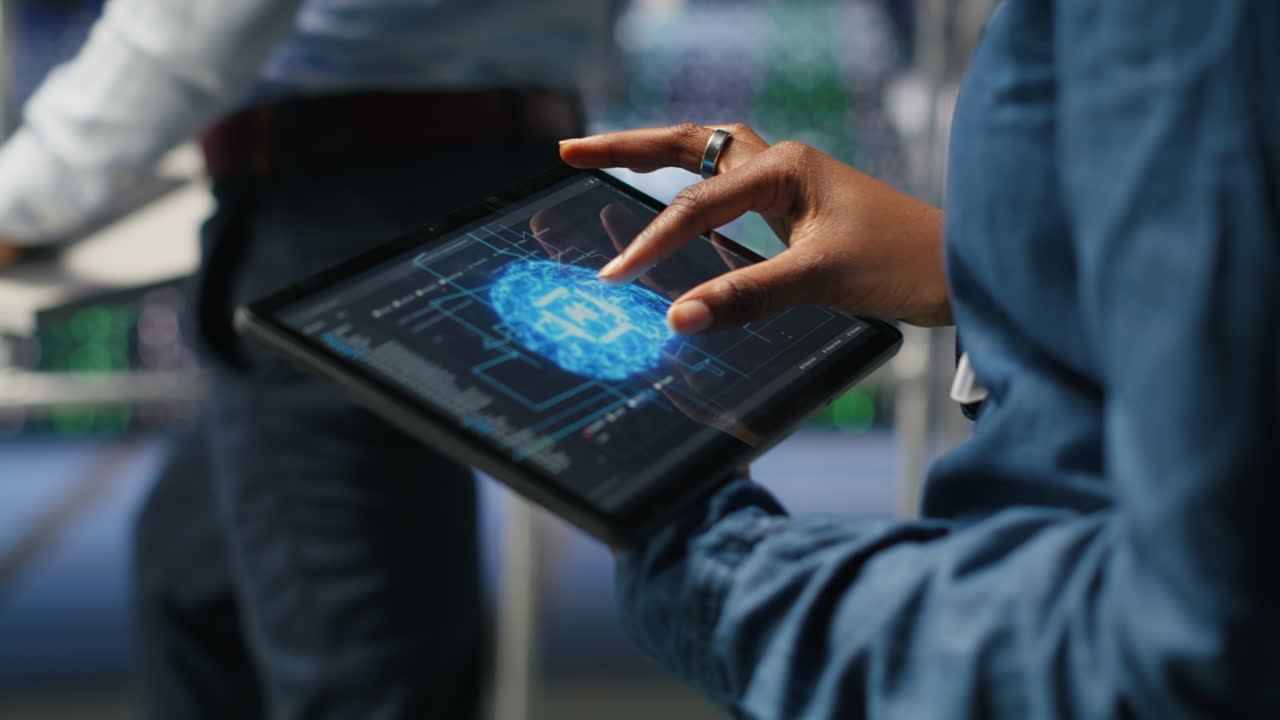 Close up of data center engineer using tablet, doing maintenance on AI rigs