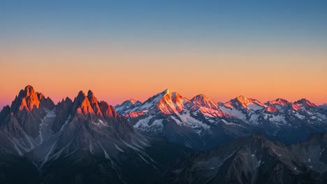 breathtaking sunrise over majestic mountain range: a stunning display of nature's beauty with vibrant colors and snow-capped peaks illuminated at dawn
