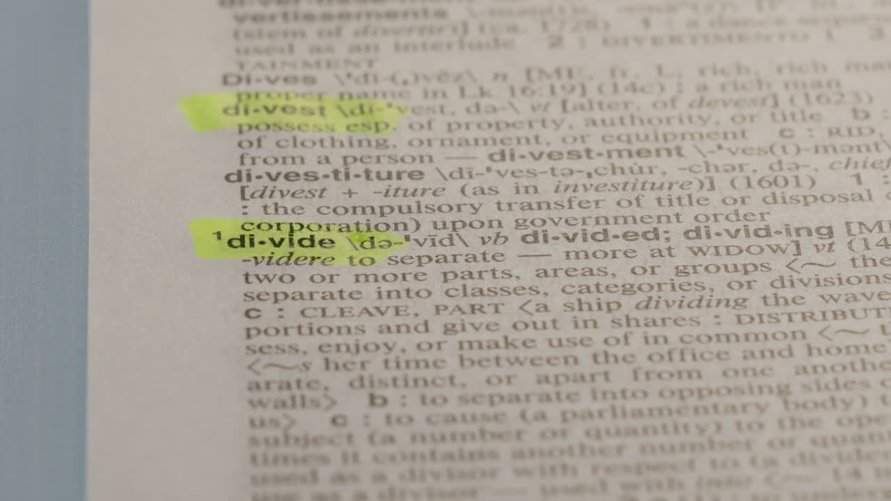Divide Political Dictionary Highlighter Concept, highlighting a word in a dictionary to show it's definition