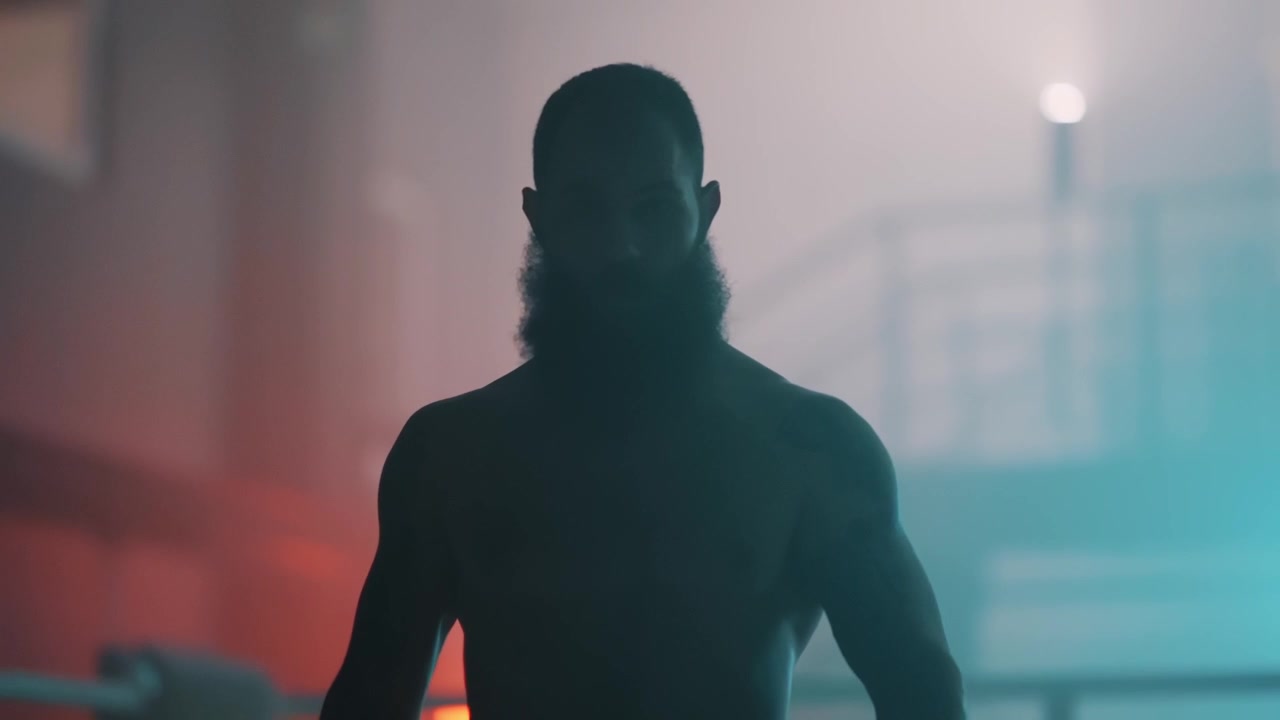 Powerful Boxer Silhouette in Smoky Ring with Dramatic Lighting