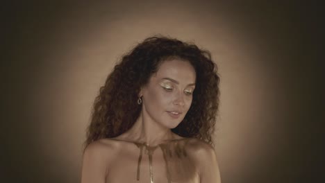 woman with gold glitter makeup