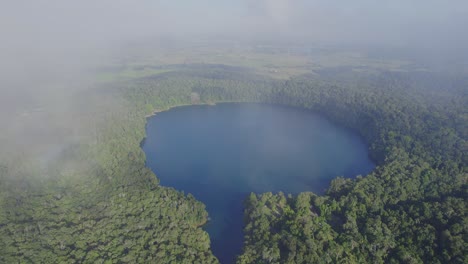 Scenic-Volcanic-Lake-Eacham-In-North-Queensland,-Australia---aerial-drone-shot