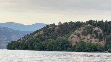kastoria lake orestiada greece nature calm water surface west macedonia outdoor cloudy sky