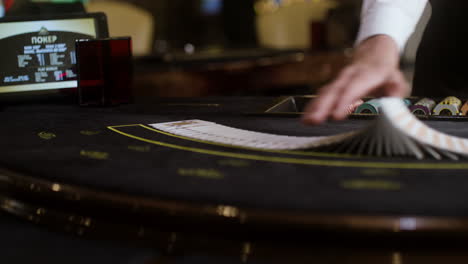 croupier shuffling poker cards.