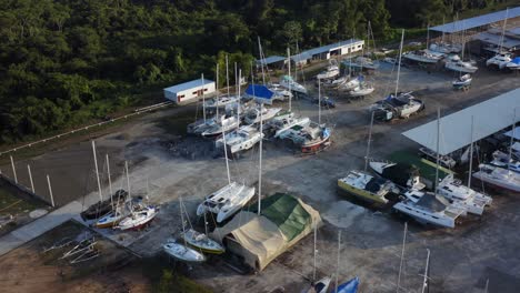 an array of small yachts in dry dock for maintenance and service work