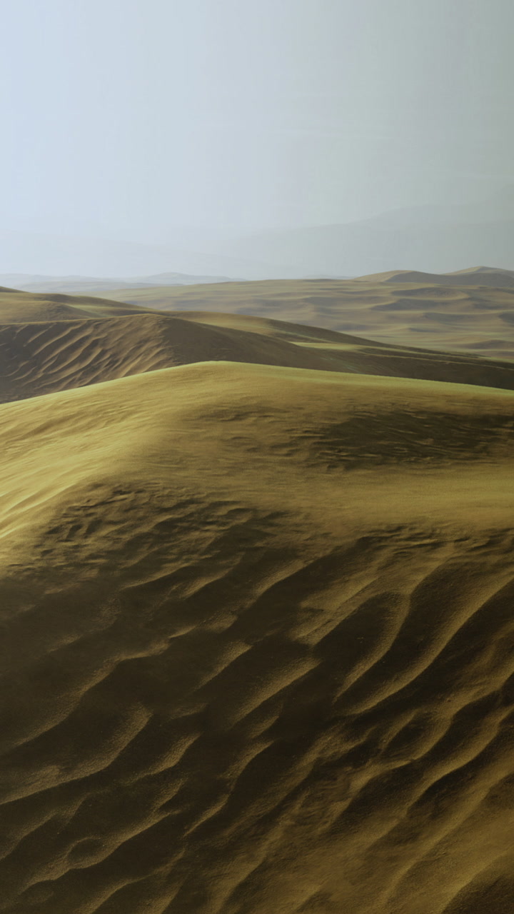 Vast landscape of rolling sand dunes in the desert during midday hours