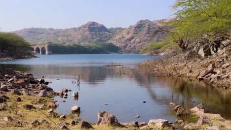 pristine-lake-calm-water-with-mountain-background-at-day-from-different-angle-video-is-taken-at-kaylana-lake-jodhpur-rajasthan-india